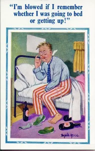 Komik-Postkarte, Mann mit Kopfschmerz auf dem Bett Datum: 20. Jahrhundert