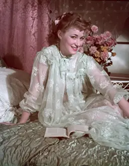 Woman Relaxing In Bed Drucke: See-Through Neglige