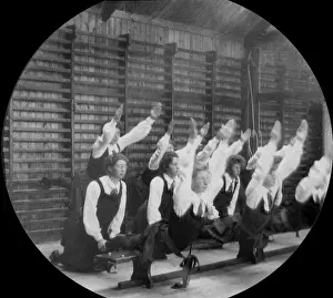 Physical Education History Drucke: Students supporting each other on parallel bars
