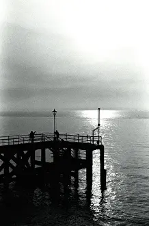 Atmospheric Sunset Image Drucke: Sunset over a pier