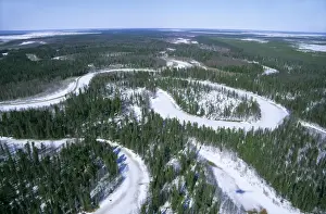 Russian Wilderness Photography Drucke: Frozen river meanders in Taiga-forest