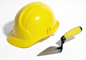 Industrial Construction Equipment Drucke: Bricklayers hard hat and trowel