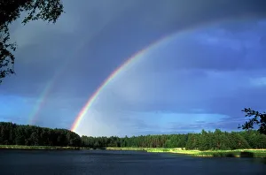 Regenbogen Drucke: Doppelbogen über einem See