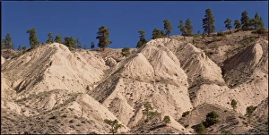 Weathered Rock Formations Drucke: Eroded side of a river canyon