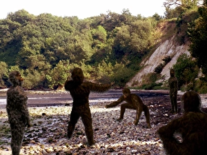 Human Evolution Timeline Drucke: Group of hominids, computer artwork