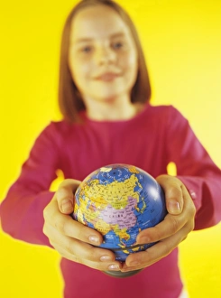 Child Holding Globe Drucke: Holding a globe
