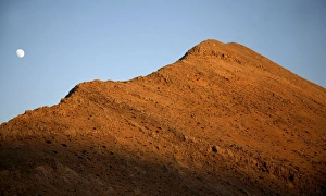 White Mountains Crete Drucke: Moon over mountain at sunset
