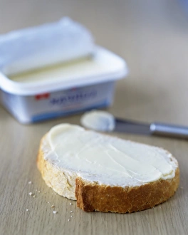 Kitchen Still Life Photos Drucke: Slice of buttered bread