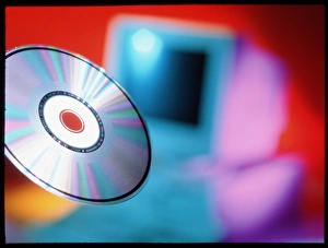 Digital Data Storage Solutions Drucke: View of CD-ROM disc in front of personal computer