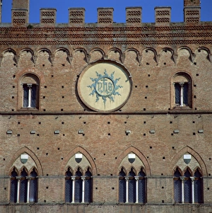 Tuscany European Landmarks Drucke: A bronze panel IHS (Jesus Mans Saviour), used as a badge by St