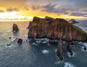 Atlantic Ocean Cliffs Europe Drucke: Burning sky at dawn on cliffs washed by ocean, Ponta do Rosto viewpoint