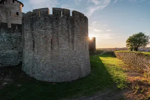 Historic Fortress Architecture Drucke: Close up of the corner wall tower with sun rays behind it