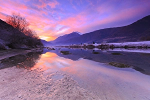 Italy Travel Destination Images Drucke: The colors of sunset are reflected in the Adda River, Valtellina, Lombardy, Italy, Europe