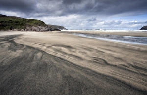 Colourful Horizon Over Water Drucke: Dalbeg Beach with intricate patterns in the sand