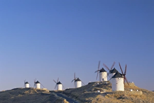 Sunny Mediterranean Landscape Drucke: Distant view of hilltop windmills