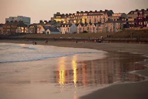 UK Travel Destination Drucke: Dusk light on the beach at Portrush
