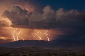 California Mountain Scenery Drucke: Electrical storm with forked lightning over the Grapevine mountains of the Amargosa Range