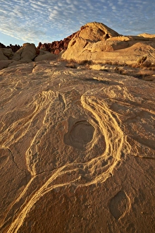 Erosion Patterns In Rocks Drucke: Erosion pattern in yellow sandstone under patterned clouds