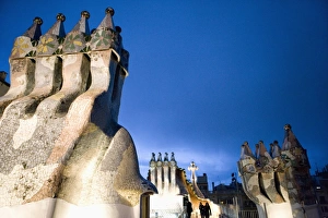 Catalonia Travel Images Drucke: Evening view of chimneys and rooftop