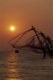 Fishing Boats At Sunset Drucke: Fishing nets at sunset