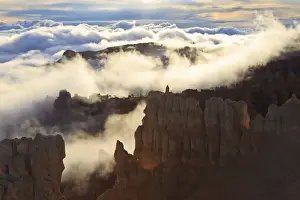 North American Scenery Drucke: Fog and clouds of a partial temperature inversion surround the red rocks of Bryce Canyon