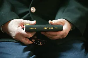 Christian Symbols In Art Drucke: Hands holding Bible, Immaculate Conception Cathedral, Beijing, China, Asia