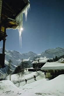 Snowy Mountain Landscape Switzerland Drucke: Icicles on chalet and deep snow