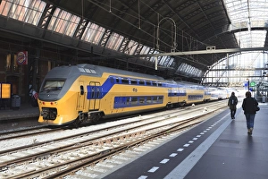 European Transportation Hub Drucke: Intercity train in a platform at Central Station, Amsterdam, Netherlands, Europe