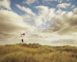 Rural Landscape Photography Drucke: Little boy playing with model plane