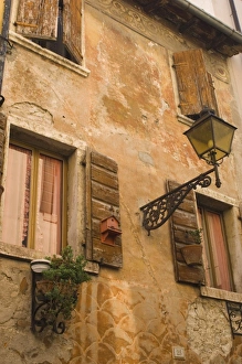Lazise Italy Drucke: Old wall with shuttered windows
