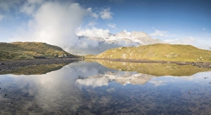 Graubunden Switzerland Tourism Drucke: Panoramic of mountain peaks reflected in lake, Bernina Pass, Poschiavo Valley, Engadine