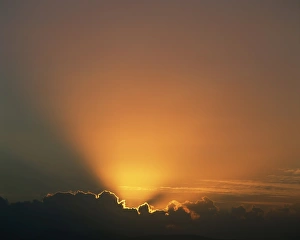 Outdoor Travel Images Drucke: Rays of light bursting out of dark clouds