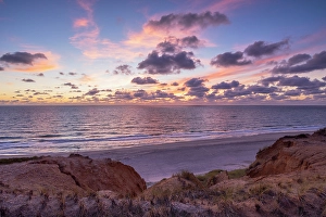 Europe Beach Destinations Drucke: Red Cliffs beach (Rotes Kliff) at sunset