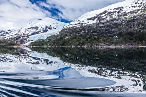 South America Scenery Drucke: Reflections in calm water in the Strait of Magellan, Patagonia, Chile, South America