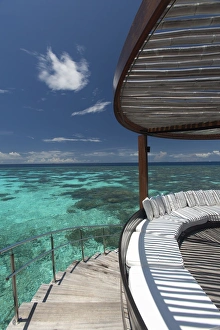Tropical Vacation Destinations Drucke: Stairs to the beach and sofa overlooking the ocean, Maldives, Indian Ocean, Asia