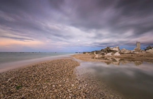 Sunset On The Adriatic Coast Drucke: Storm clouds are reflected in the clear water at sunset
