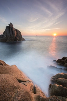 Capo Testa Sardinia Drucke: The sun setting behind the rocks of the peninsula of Capo Testa