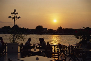 Bangkok Cityscape At Dusk Drucke: Sunset over the Chao Phya River from the terrace of