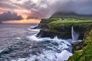Faroe Islands Sunset Drucke: Sunset at the waterfall and cliffs of Gasadalur, Faroe Islands, Denmark, Europe