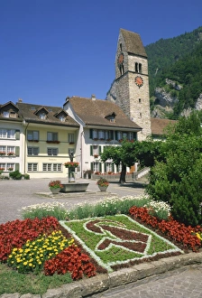 Jungfrau Region Travel Drucke: Symbol in flowers and clock tower