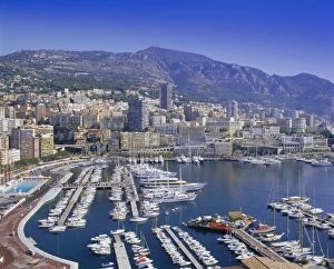 Drucke von Blick über den Hafen und die Stadt nach Monte-Carlo in Monako an der Küste des Mittelmeers Monaco Drucke: Blick über den Hafen und die Stadt Montecarlo in Mönacho-Monako an der Küste des Mittelmeers im Europa