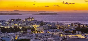 Greek Island Views Drucke: View of windmills and Aegean Sea from elevated position at sunset, Mykonos Town, Mykonos