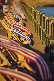 Beach Huts In England Drucke: Windblown deckchairs on seafront, Sidmouth, Devon, England