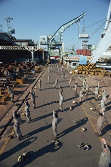 Morning Exercise Routine Drucke: Workers stretching and exercising before work in the morning