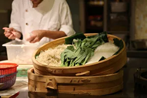 Chinesischer Koch im Küchen