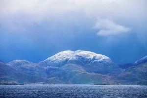 Latin America Coastal Landscapes Drucke: Brooding clouds over the isalnds in the Strait, Strait of Magellan, Patagonia, Chile