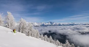 Skiing In Western Europe Drucke: Skier over the clouds at Cima della Rosetta, Valgerola, Valtellina, Lombardy, Italy, Alps