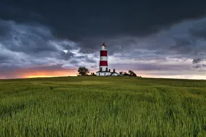 British Coastal Landscapes Drucke: Storm Clouds at Sunset over Happisburgh Lighthouse, Norfolk, England