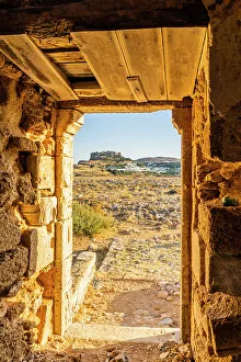 Windmills In Greece Drucke: A view of the Acropolis of Lindos through an old windmill