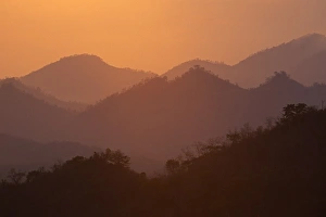 Laos Travel Photography Drucke: View of hills at sunset from the summit of